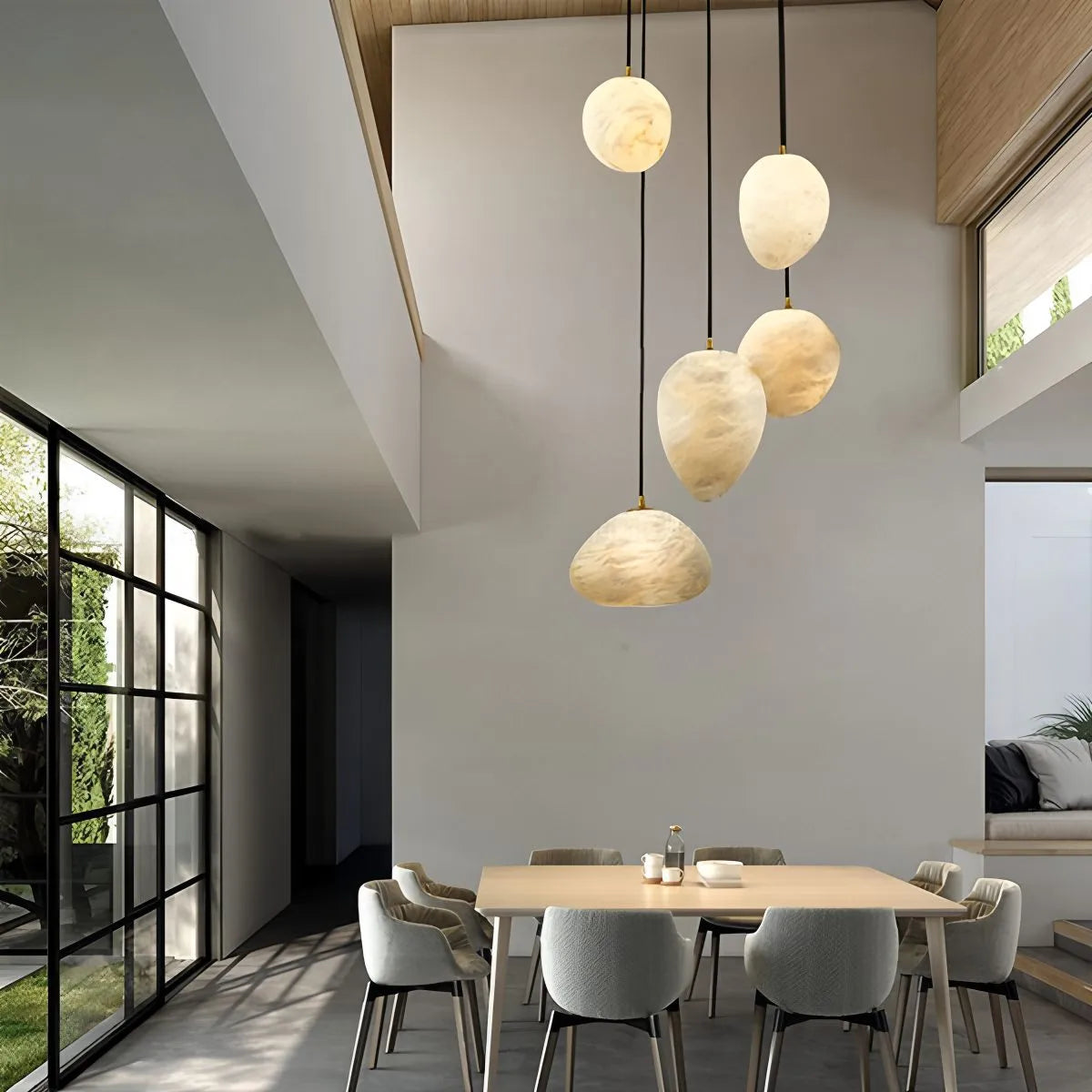 Modern pendant light made of alabaster and copper, featuring a white finish and adjustable height, perfect for dining rooms. 7