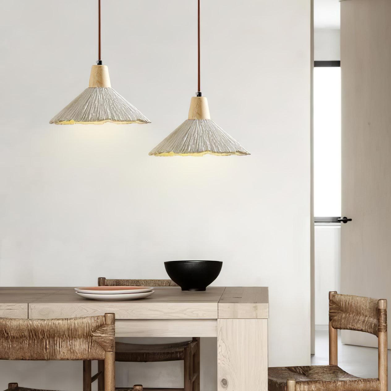 Modern pendant light with a concrete finish and wood details, featuring an E27 socket. Perfect for dining tables and living rooms. 3