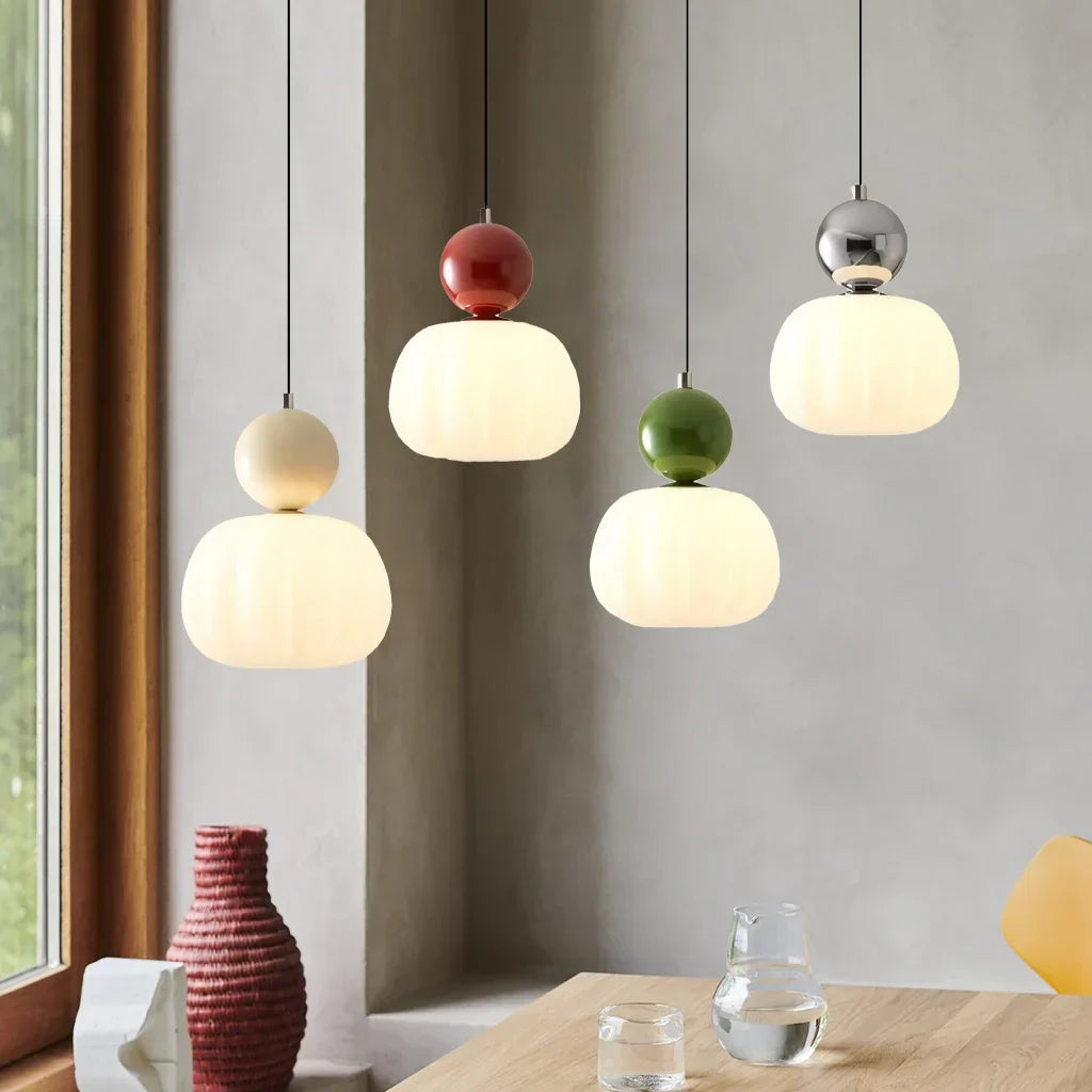 A colorful pendant light made of metal and PMMA, featuring a playful design with a diameter of 16 cm, ideal for modern spaces. 2